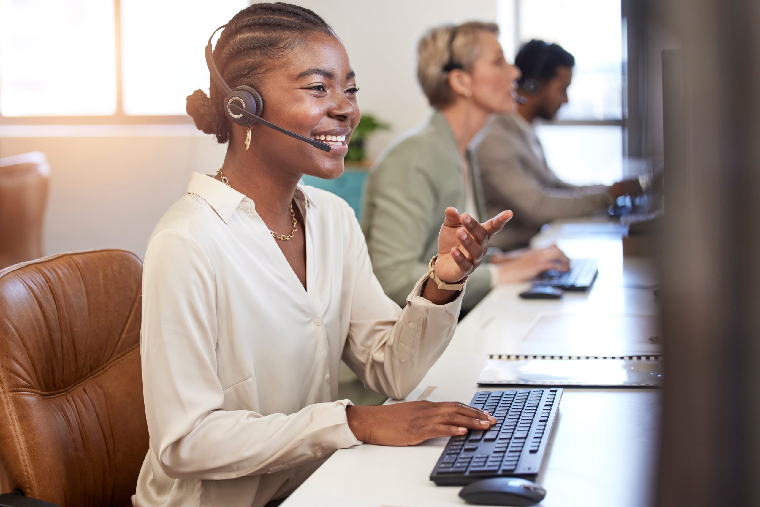 Call center, speaking and business woman in office, agency or ecommerce, talking or client account update. Agent, virtual consultant or african person on computer advice, support or customer solution.